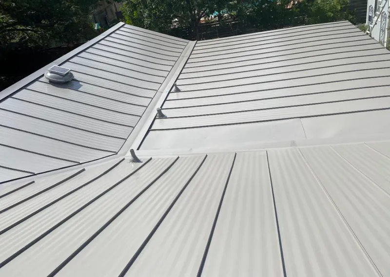 Solar attic fan installed on a metal roof for Roof Ventilation in Danville